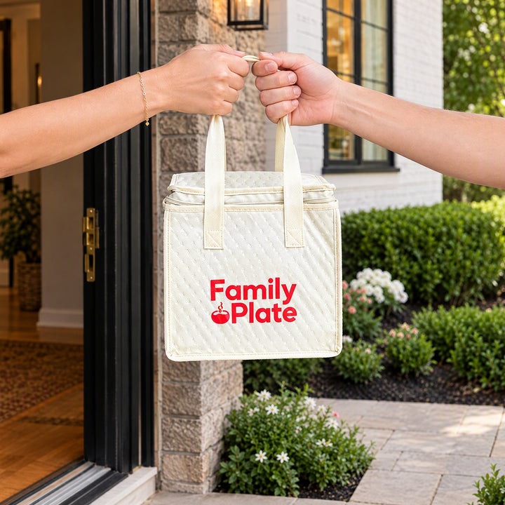 Chefs cooking fresh homestyle meals in the Family Plate kitchen